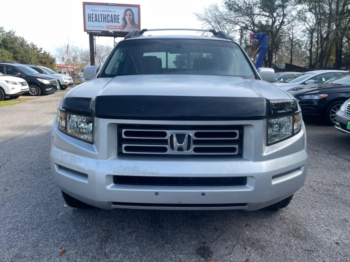 2007 SILVER HONDA RIDGELINE RTS (2HJYK16467H) with an 3.5L engine, Automatic transmission, located at 5103 Dorchester Rd., Charleston, SC, 29418-5607, (843) 767-1122, 36.245171, -115.228050 - Clean & Spacious Interior with 6-Disc CD/AUX/Sat, Dual Climate Control, Power Everything (windows, locks, seats, mirrors), All-weather Mats, Keyless Entry, Tow Package, Alloy Wheels. Clean CarFax (no accidents reported!) Local Trade-in!! 146k miles Located at New Life Auto Sales! 2023 WINNER for Po - Photo#1